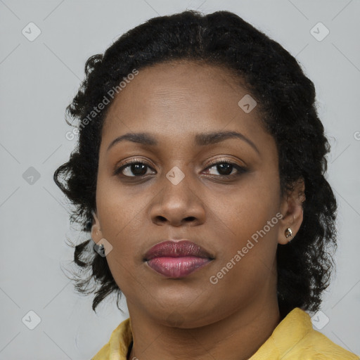 Neutral black young-adult female with long  brown hair and brown eyes