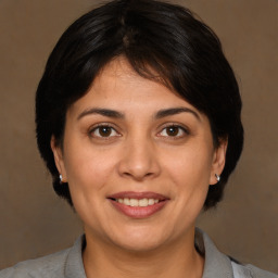 Joyful white adult female with medium  brown hair and brown eyes