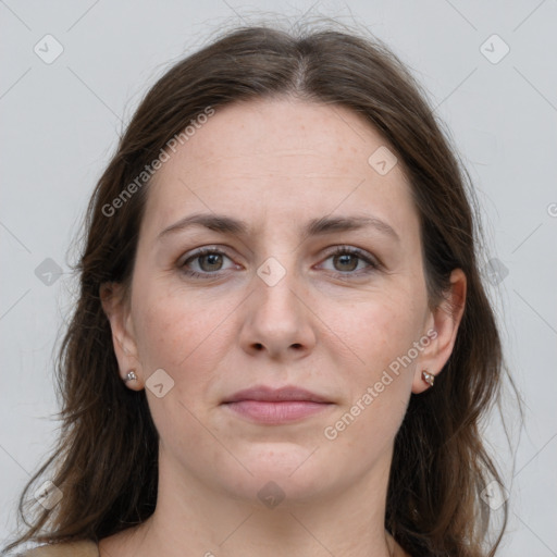 Joyful white young-adult female with long  brown hair and grey eyes