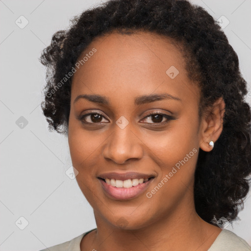 Joyful black young-adult female with medium  black hair and brown eyes