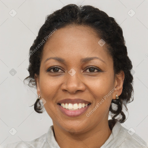 Joyful black adult female with short  brown hair and brown eyes