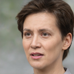 Joyful white adult female with short  brown hair and brown eyes