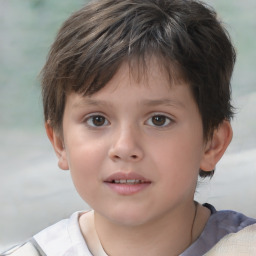 Joyful white child male with short  brown hair and brown eyes