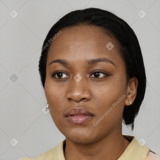 Neutral black young-adult female with short  black hair and brown eyes