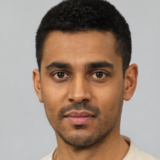 Neutral black young-adult male with short  black hair and brown eyes