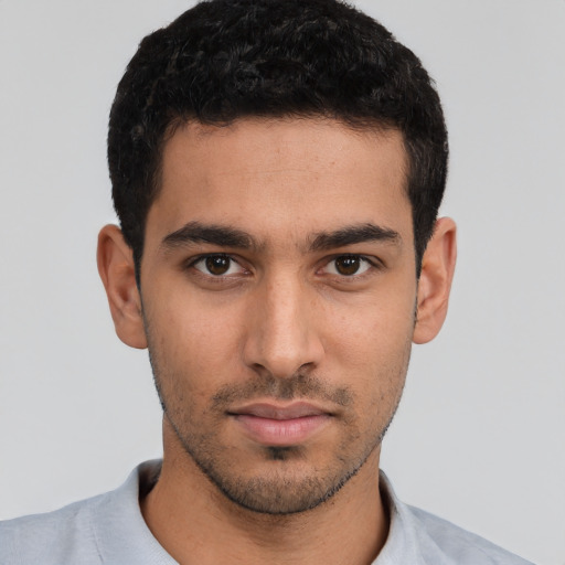 Neutral white young-adult male with short  black hair and brown eyes