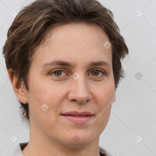 Joyful white adult female with short  brown hair and brown eyes