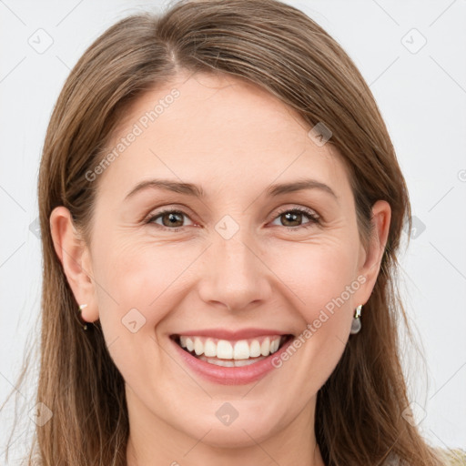 Joyful white young-adult female with long  brown hair and brown eyes