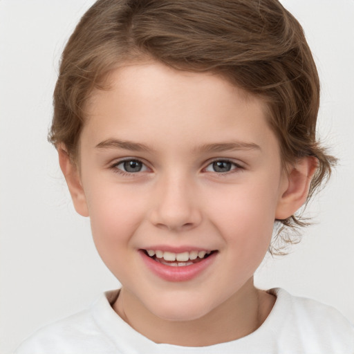 Joyful white child female with short  brown hair and brown eyes