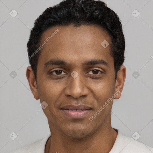 Joyful black young-adult male with short  black hair and brown eyes