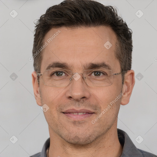 Joyful white adult male with short  brown hair and brown eyes