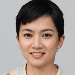 Joyful asian young-adult female with short  black hair and brown eyes