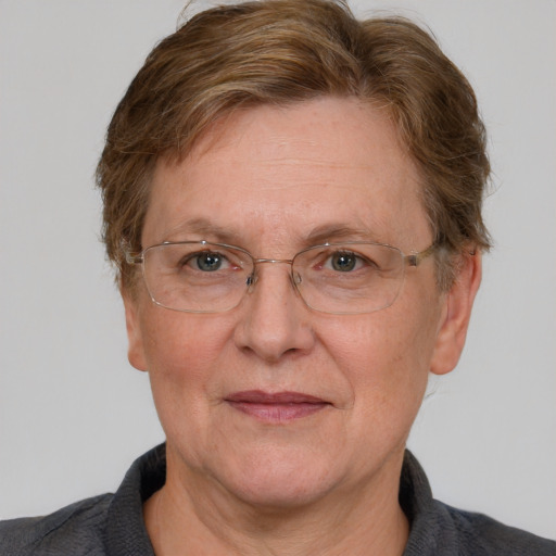 Joyful white middle-aged female with short  brown hair and blue eyes