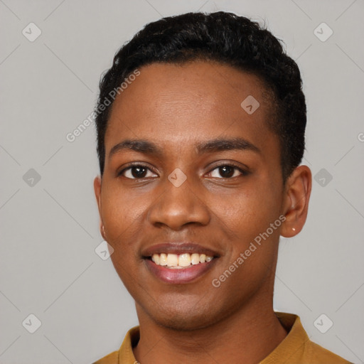 Joyful black young-adult male with short  black hair and brown eyes