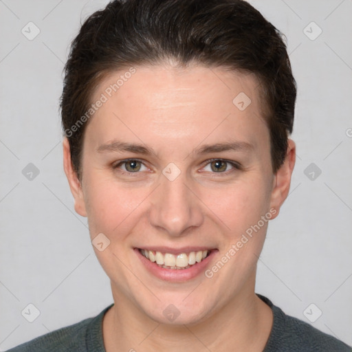 Joyful white young-adult female with short  brown hair and grey eyes