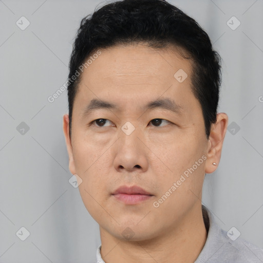 Neutral asian young-adult male with short  black hair and brown eyes