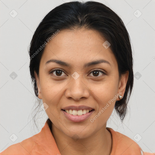 Joyful latino young-adult female with medium  brown hair and brown eyes