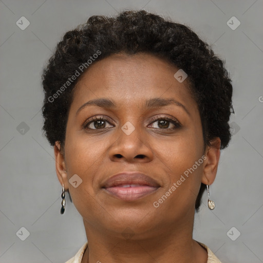 Joyful black adult female with short  brown hair and brown eyes