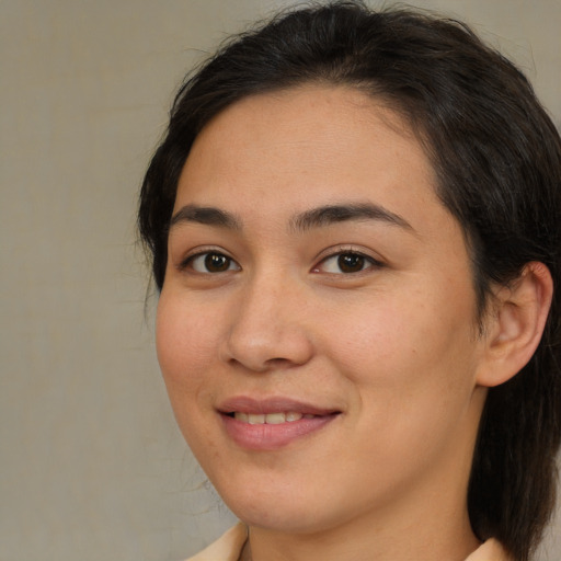 Joyful white young-adult female with medium  brown hair and brown eyes