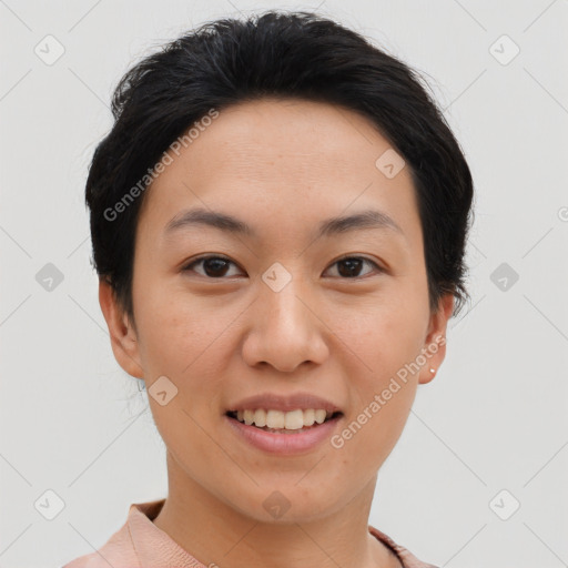 Joyful asian young-adult female with short  black hair and brown eyes