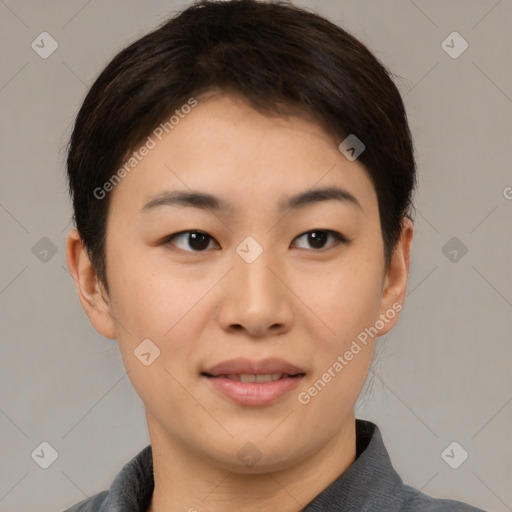 Joyful asian young-adult female with short  brown hair and brown eyes