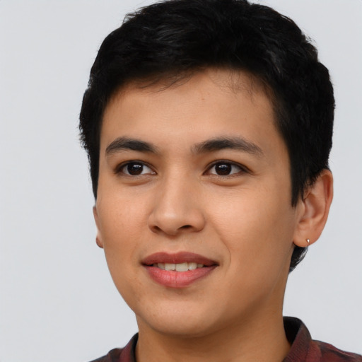 Joyful asian young-adult male with short  black hair and brown eyes