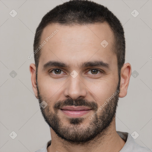 Joyful white young-adult male with short  black hair and brown eyes