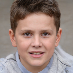 Joyful white child male with short  brown hair and brown eyes