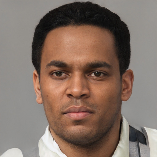 Neutral black young-adult male with short  black hair and brown eyes