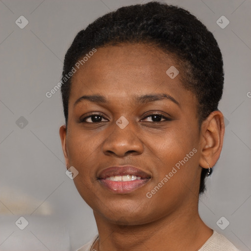 Joyful black young-adult female with short  brown hair and brown eyes