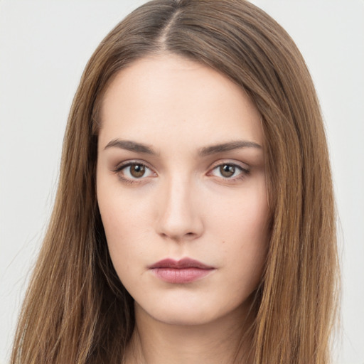 Neutral white young-adult female with long  brown hair and brown eyes