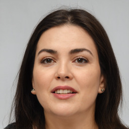 Joyful white young-adult female with medium  brown hair and brown eyes