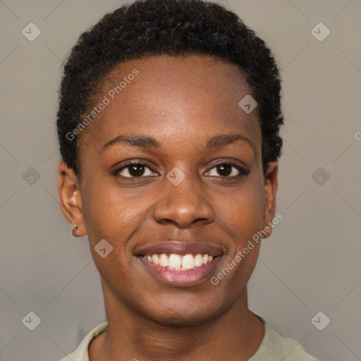 Joyful black young-adult female with short  brown hair and brown eyes