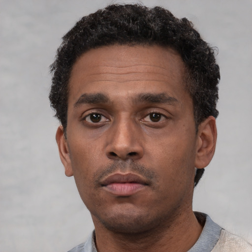 Neutral latino adult male with short  brown hair and brown eyes