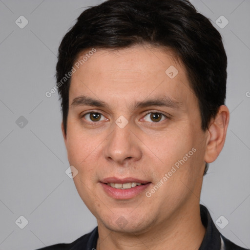 Joyful white adult male with short  brown hair and brown eyes