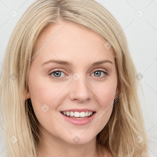 Joyful white young-adult female with long  brown hair and blue eyes