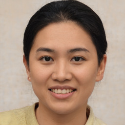 Joyful asian young-adult female with short  brown hair and brown eyes