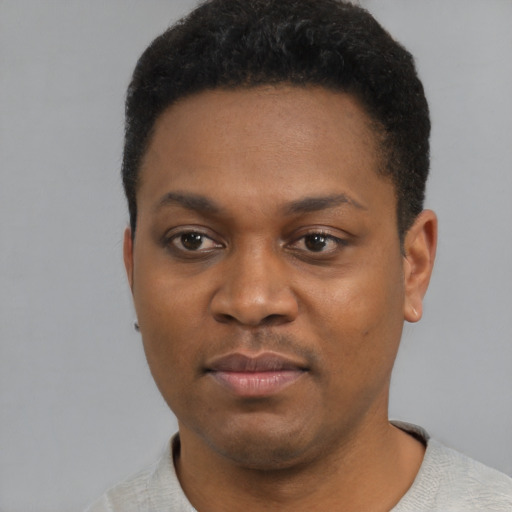Neutral black young-adult male with short  black hair and brown eyes