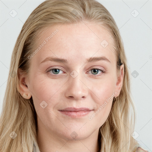 Joyful white young-adult female with long  brown hair and blue eyes