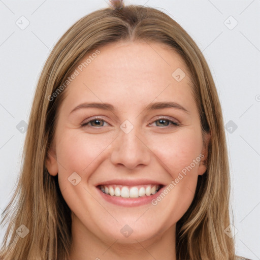 Joyful white young-adult female with long  brown hair and grey eyes