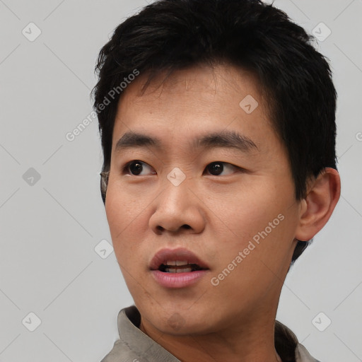 Neutral asian young-adult male with short  black hair and brown eyes