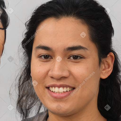 Joyful latino young-adult female with medium  brown hair and brown eyes