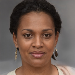 Joyful latino adult female with short  brown hair and brown eyes