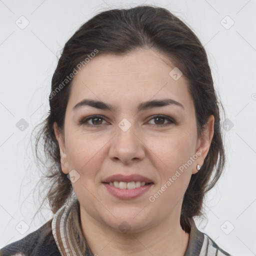 Joyful white young-adult female with medium  brown hair and grey eyes