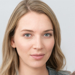 Joyful white young-adult female with long  brown hair and blue eyes