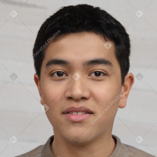 Joyful asian young-adult male with short  black hair and brown eyes