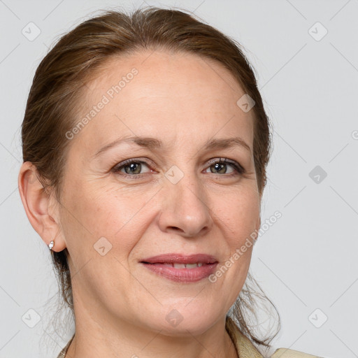 Joyful white adult female with medium  brown hair and grey eyes