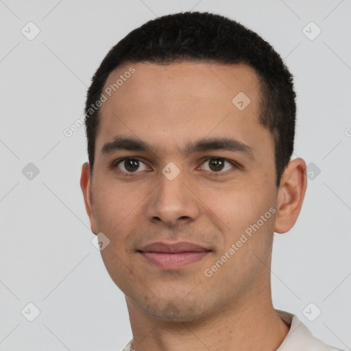 Joyful white young-adult male with short  black hair and brown eyes