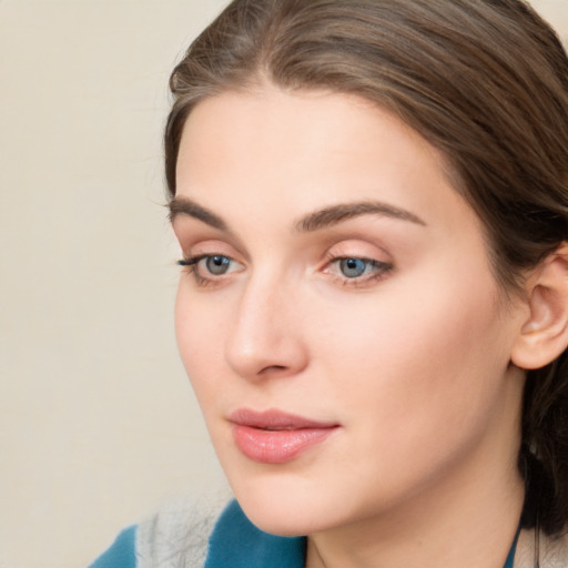 Neutral white young-adult female with medium  brown hair and blue eyes