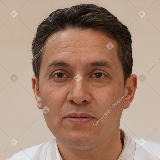 Joyful white adult male with short  brown hair and brown eyes